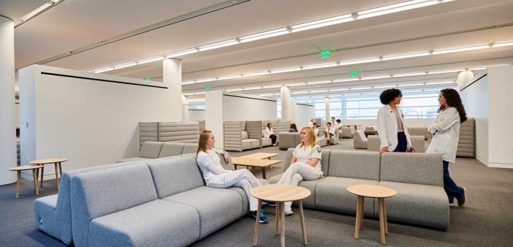 Students lounge in the study area of the Case Western Reserve and Cleveland Clinic Health Education Campus